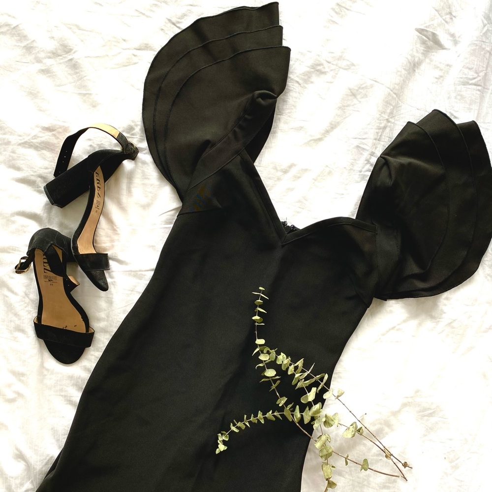Mini black dress.
